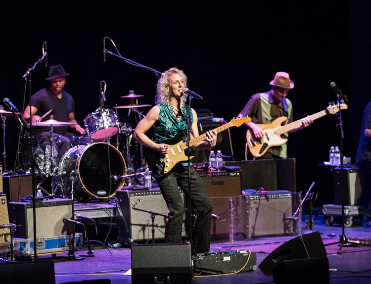 Laurie Morvan performing on stage